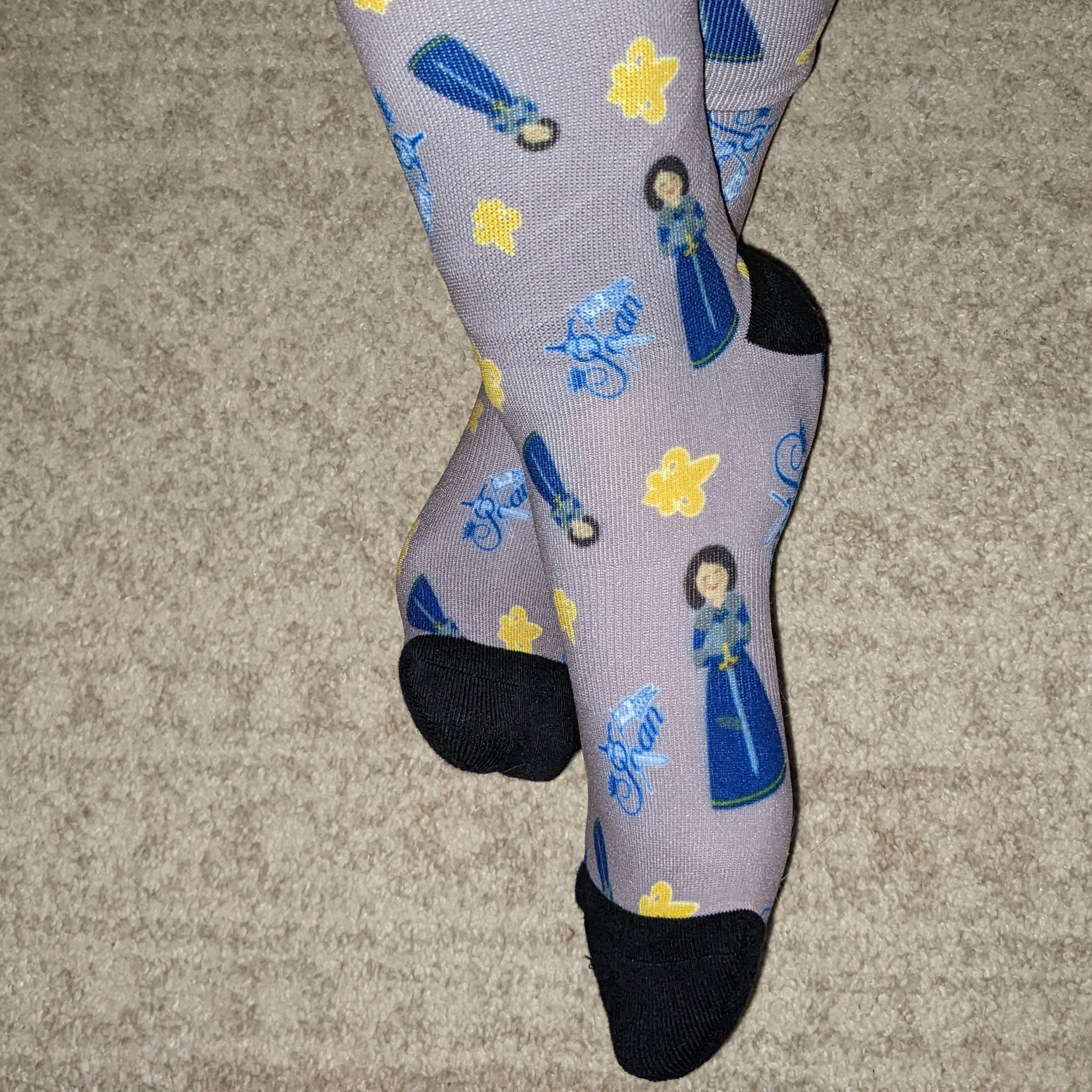 Catholic socks featuring St. Joan of Arc illustrations