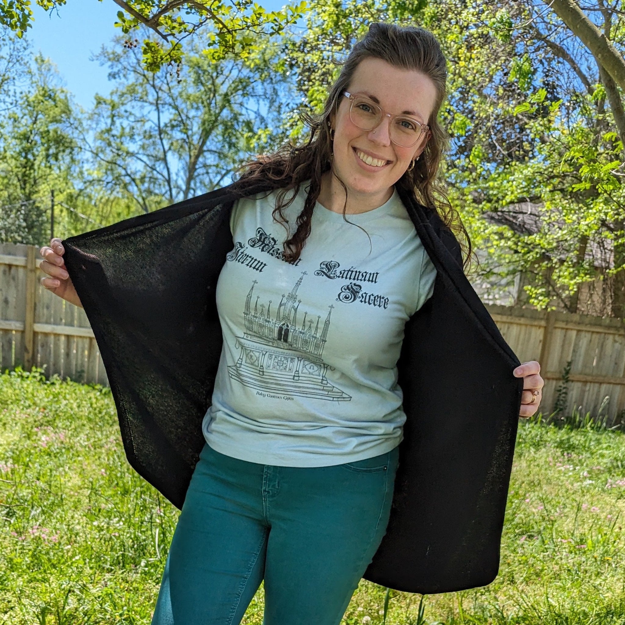 A woman wearing a Catholic shirt with a high altar from the Make Mass Latin Again collection